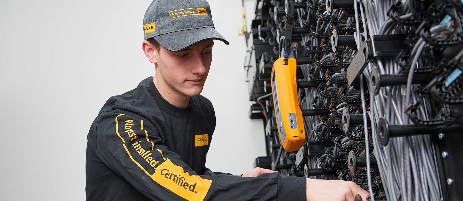 Fluke tech using cable testing device